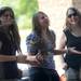 Friends, from left,  Kylee (no last name given), 16, of Bloomfield, Hailey Broderick, 14, of Holly and Bia Cassano, 15, Pontiac dance as Alejandra O'Leary and her band performs at the Summer Concert Series on the porch at AnnArbor.com. Melanie Maxwell I AnnArbor.com